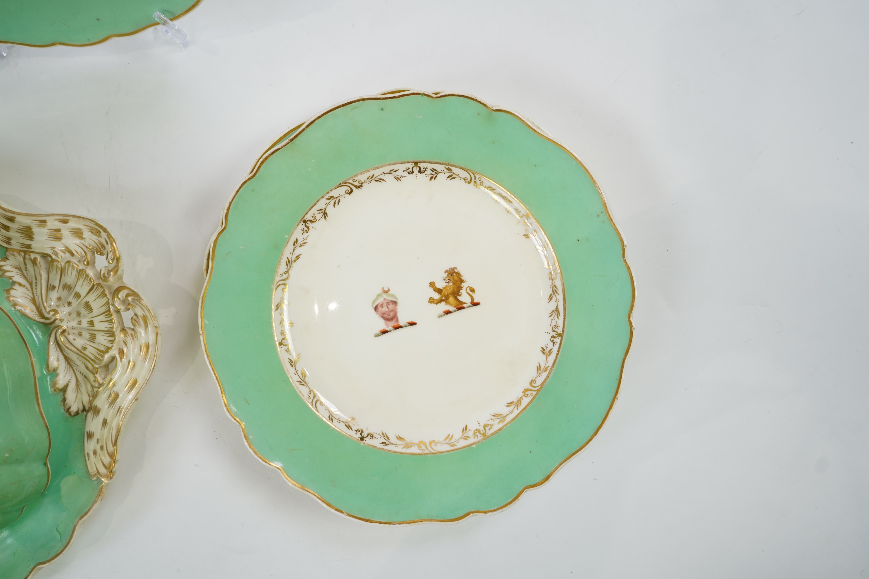 An English porcelain Turks head crested part dinner service, c.1830